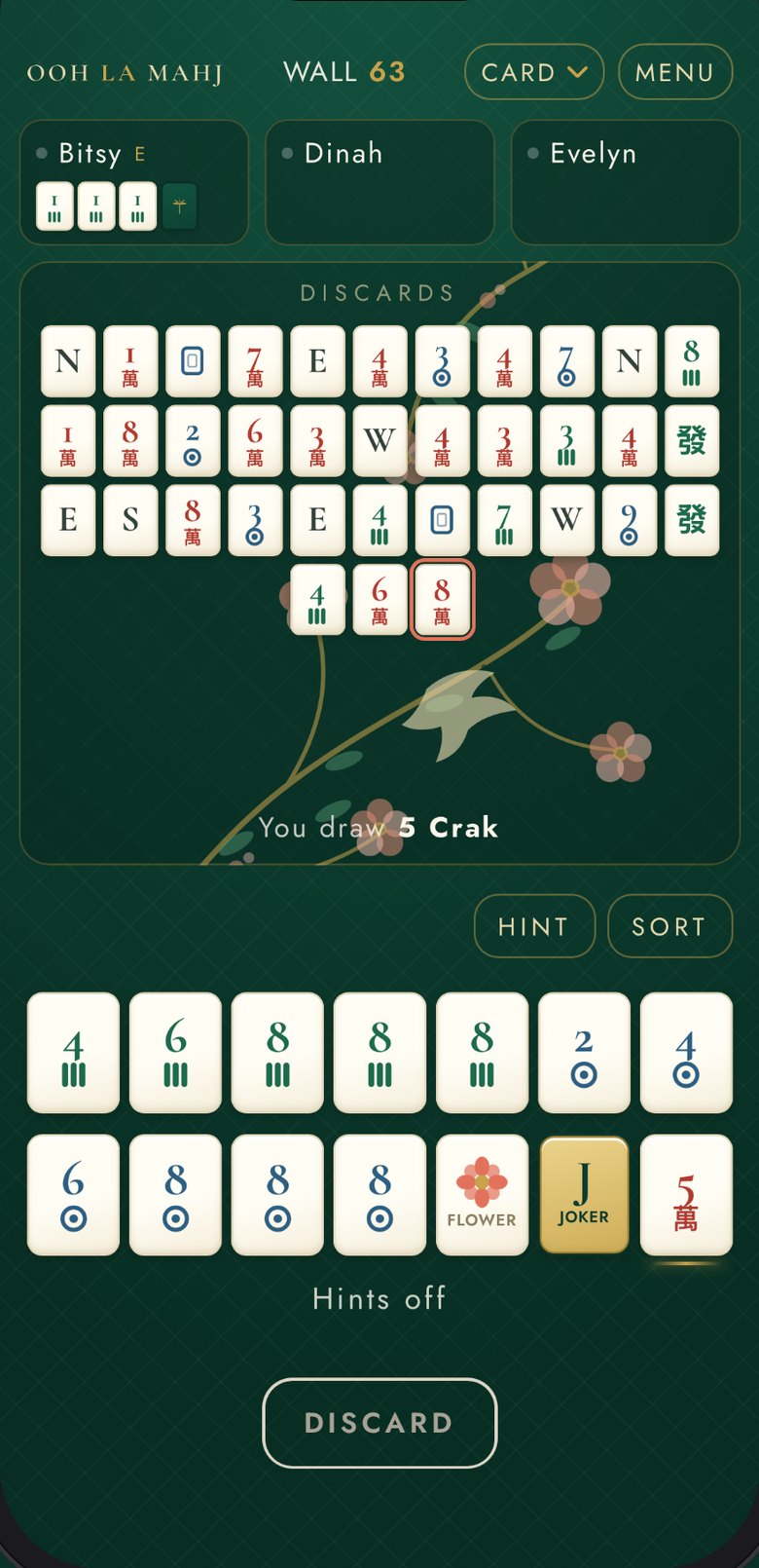 A hand in progress in Ooh La Mahj: three opponents across the top, the discards in the middle, your rack of tiles below with HINT and SORT, and a DISCARD button.